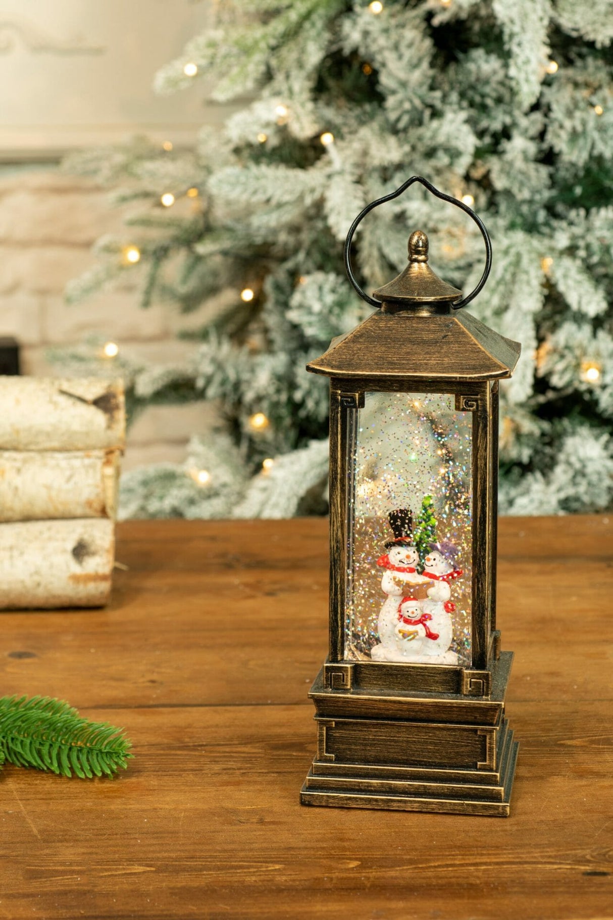 11.5" Gold Lantern Warm White LED Snow Globe with Snowman Caroler Family
