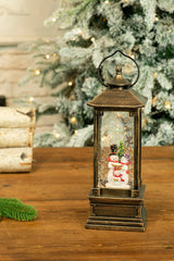 11.5" Gold Lantern Warm White LED Snow Globe with Snowman Caroler Family